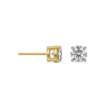 Gold and silver diamond earring on a white background
