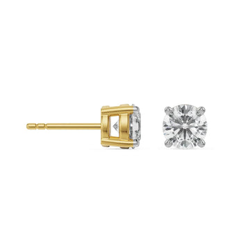 Gold and silver diamond stud earrings on a white background