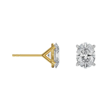 Gold and silver diamond stud earrings on a white background