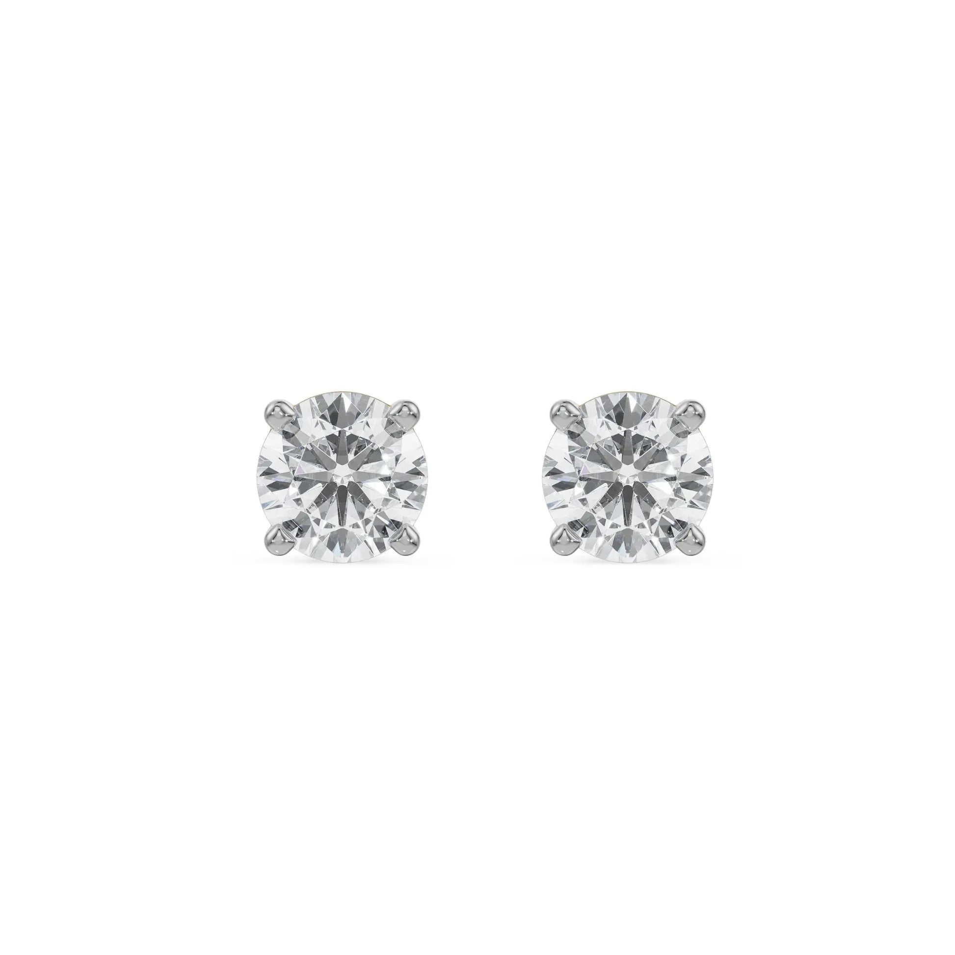 Pair of diamond stud earrings on a white background