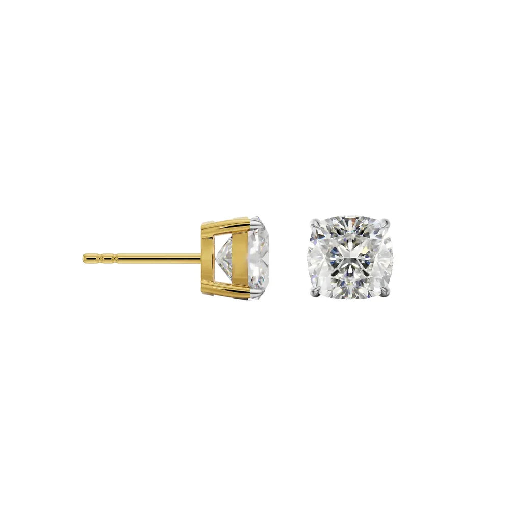 Gold and silver diamond stud earrings on a white background