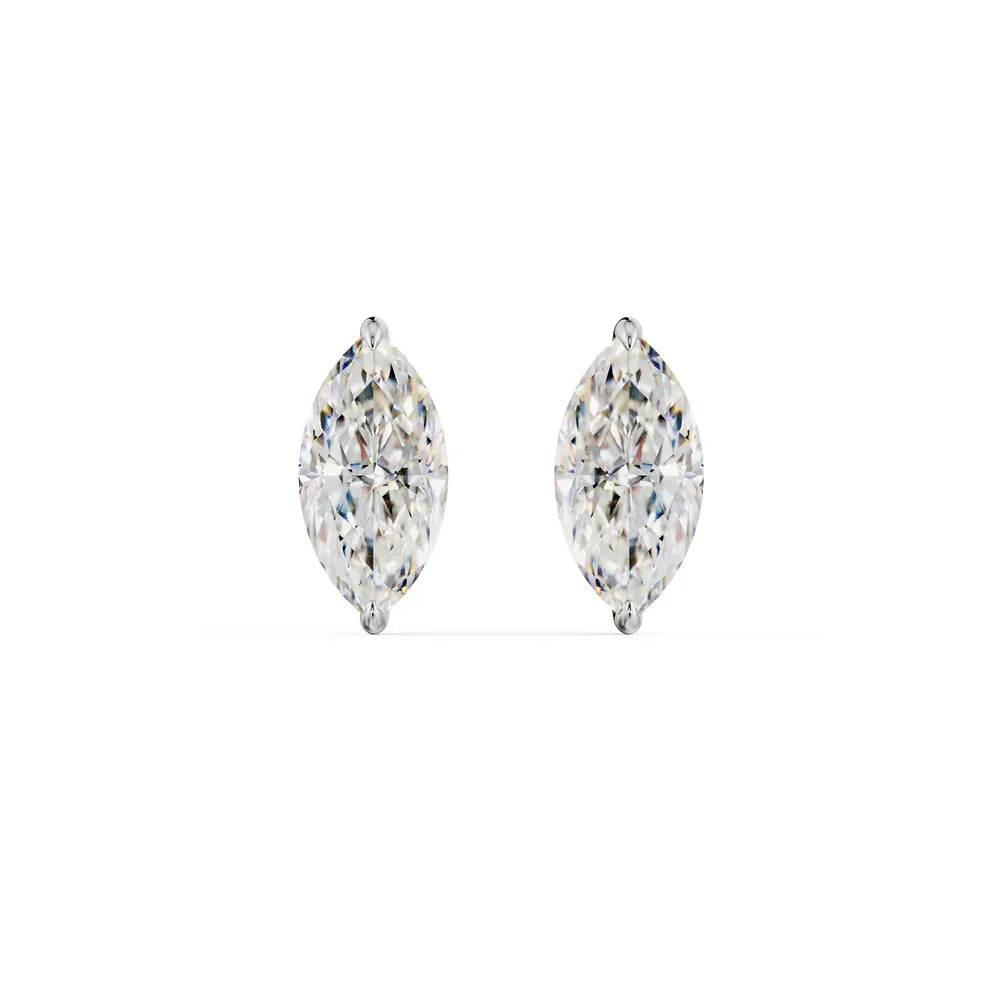 Gold and clear crystal earring on a white background