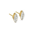 Gold earrings with clear gemstones on a white background