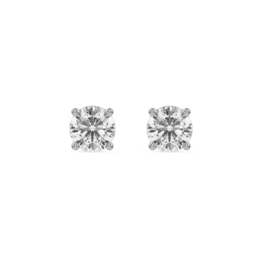 Pair of diamond stud earrings on a white background