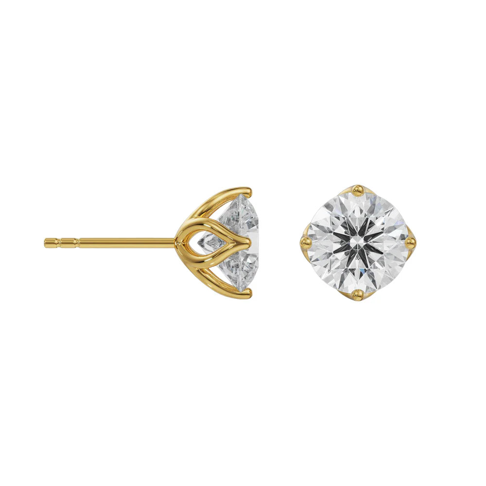 Gold stud earrings with clear gemstones on a white background