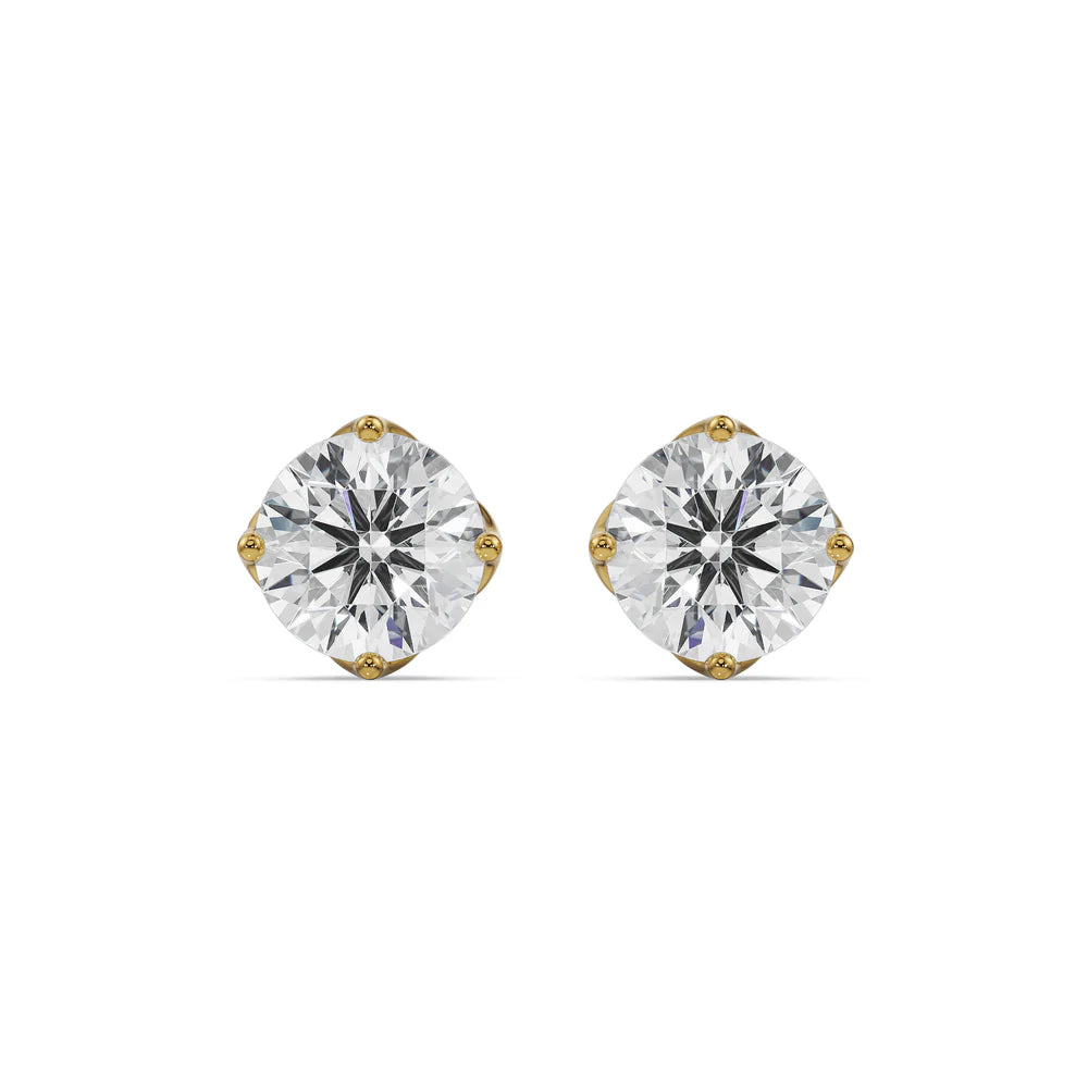 Gold stud earrings with clear gemstones on a white background