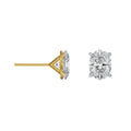 Gold and silver diamond stud earrings on a white background
