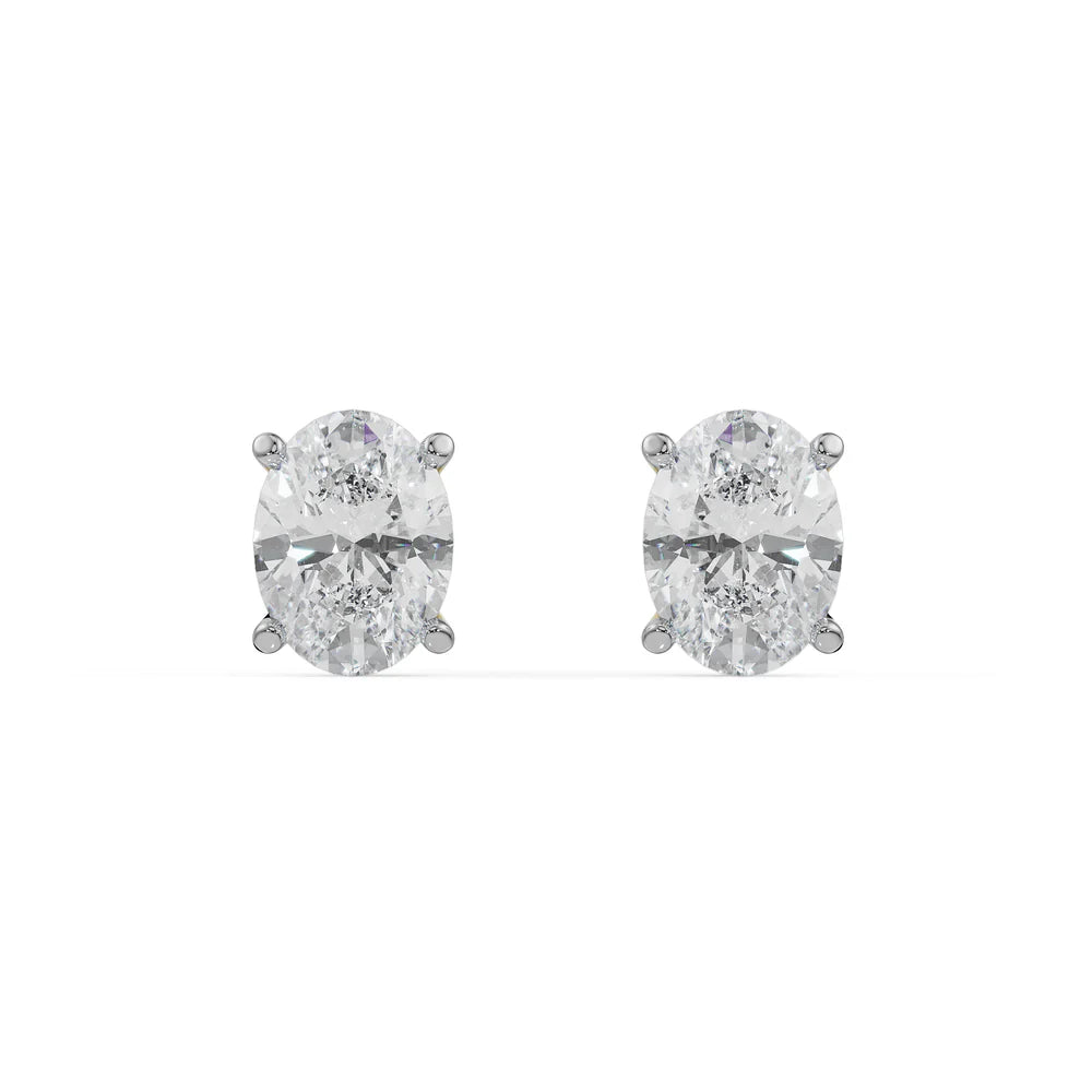 Pair of diamond stud earrings on a white background
