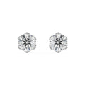 Pair of diamond stud earrings on a white background