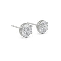 Pair of diamond stud earrings on a white background
