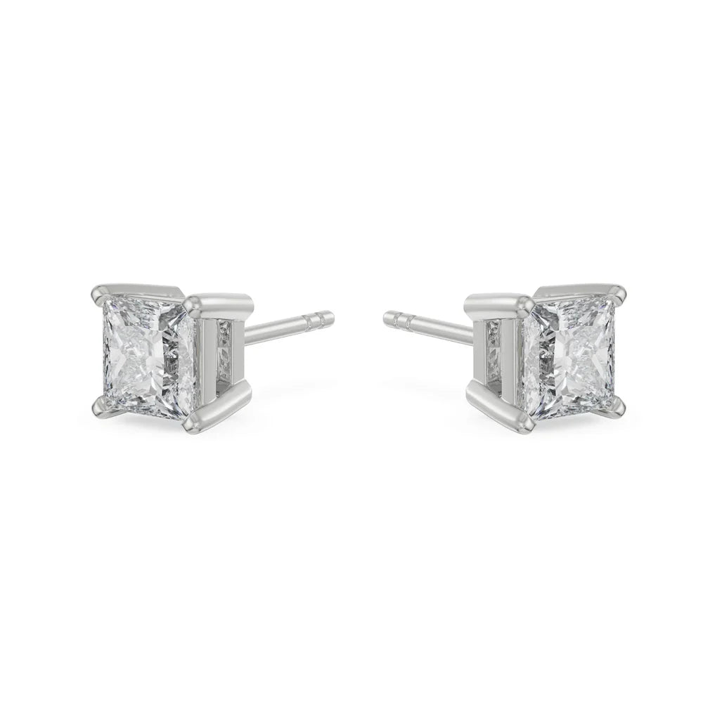Pair of diamond stud earrings on a white background