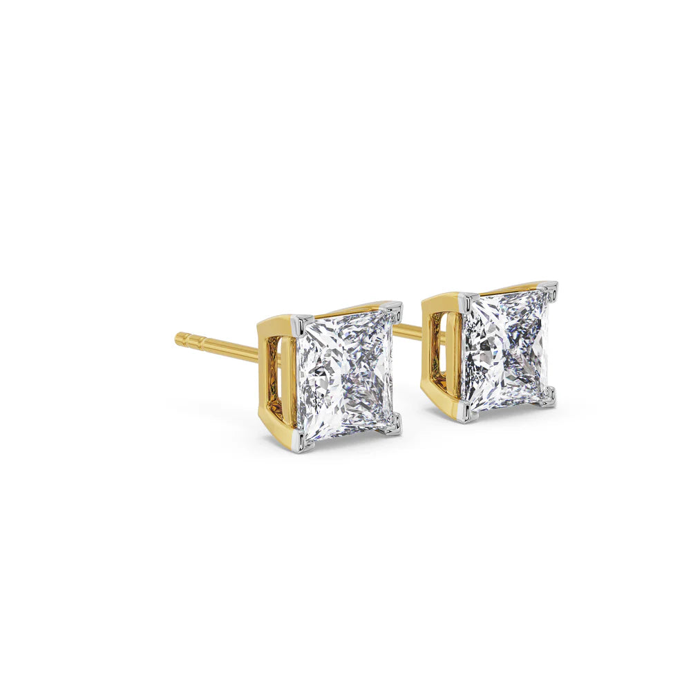 Pair of diamond stud earrings with gold prongs on a white background