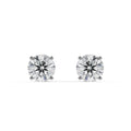 Pair of diamond stud earrings on a white background