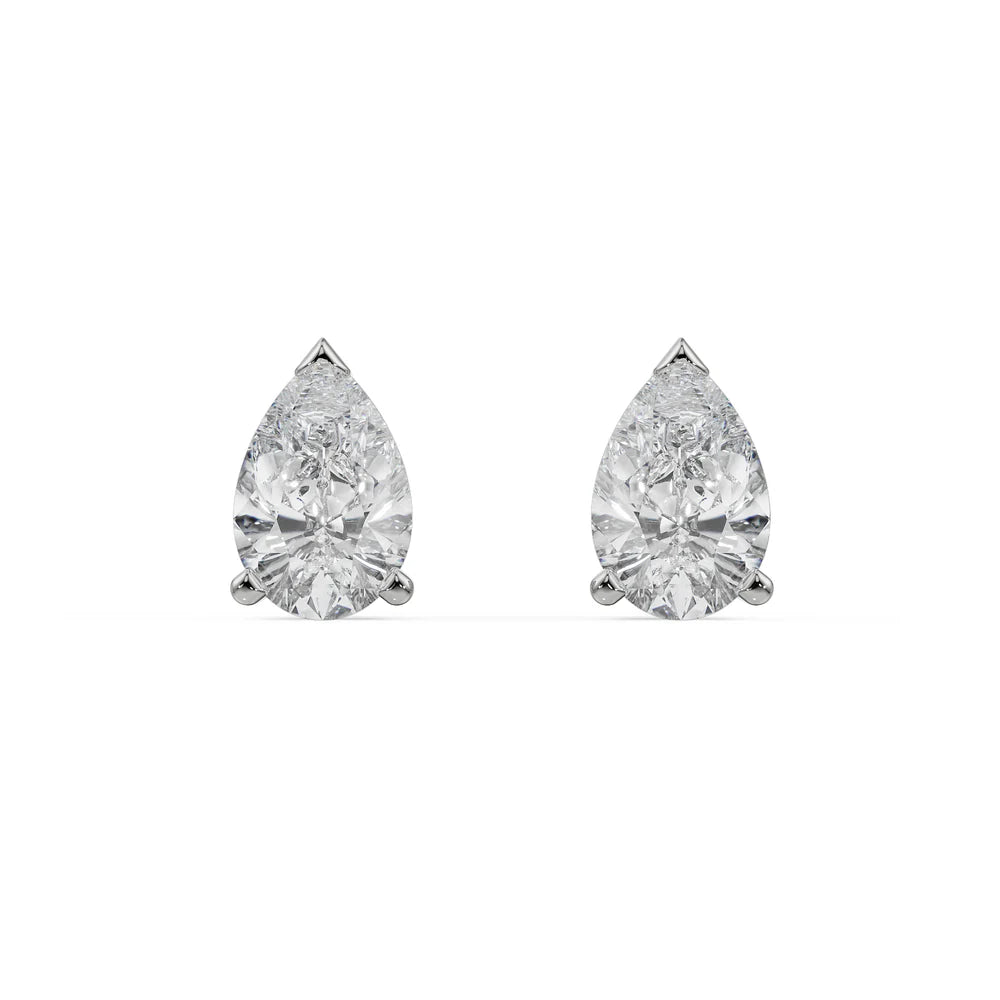Pair of pear-shaped diamond earrings on a white background