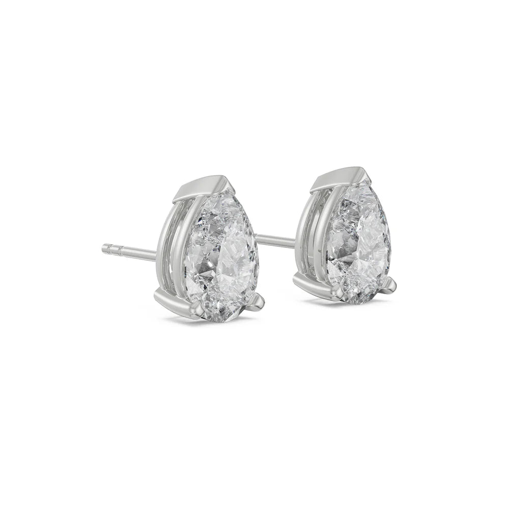 Pair of diamond stud earrings on a white background