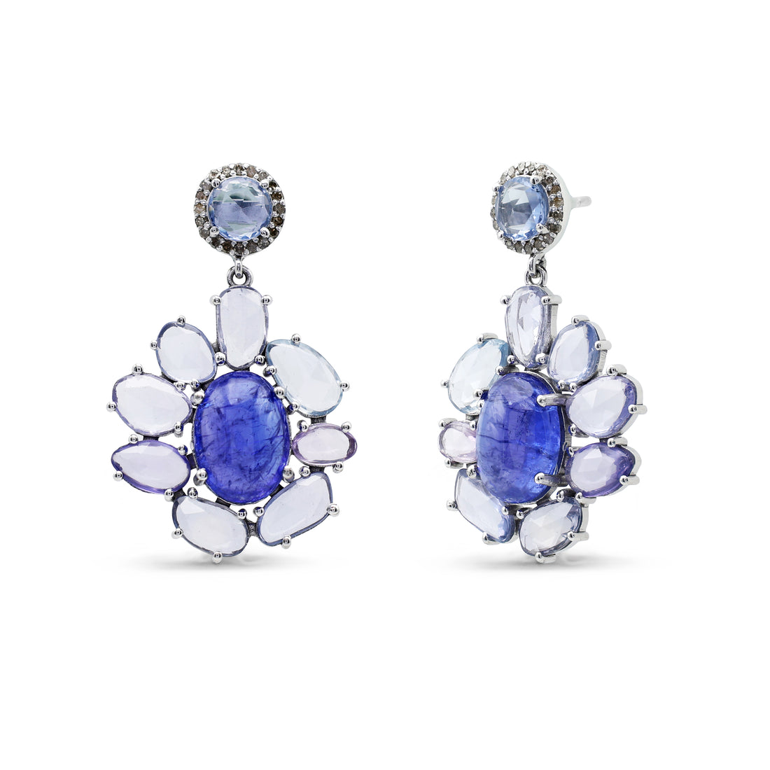 Pair of earrings with blue gemstones and white stones on a white background